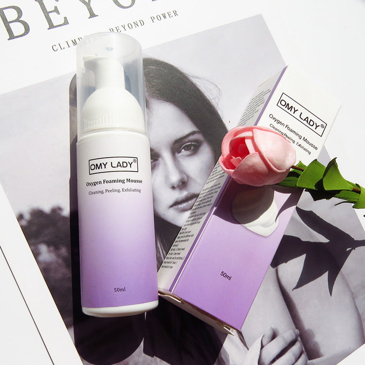 OMY LADY Cleansing Mousse 50ml bottle and box displayed with a pink rose, highlighting its exfoliating and oil control benefits for clear skin.